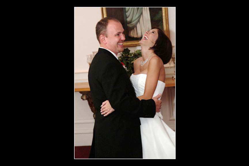 bride and groom share a laugh